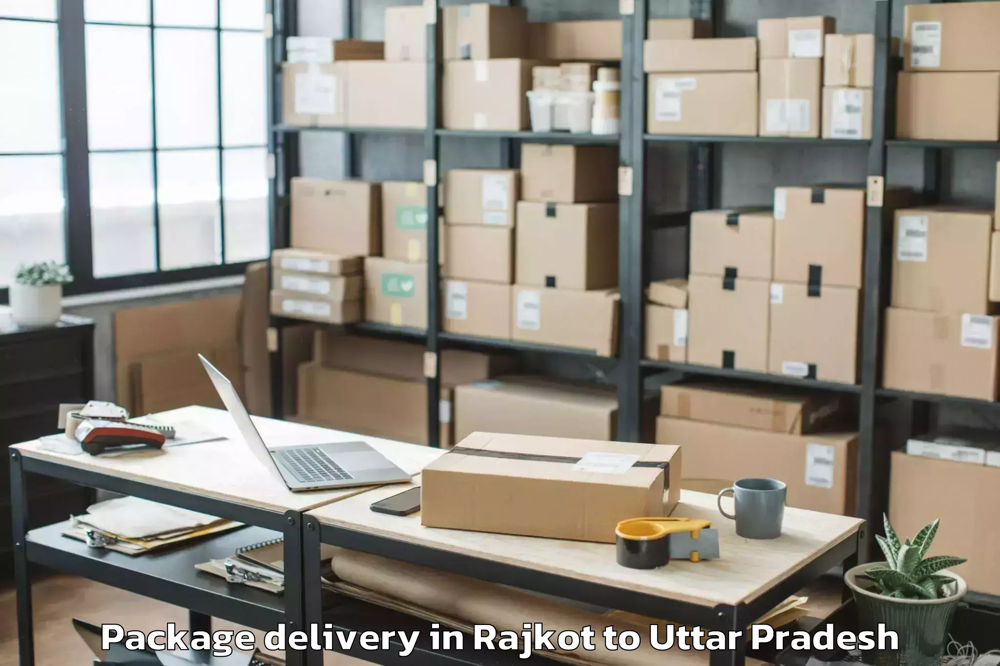 Trusted Rajkot to Bundelkhand University Jhansi Package Delivery